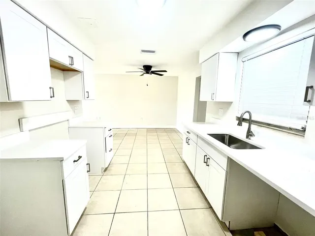 a bathroom with a sink a mirror and a shower