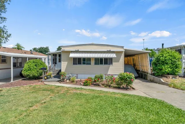 a front view of a house with a yard