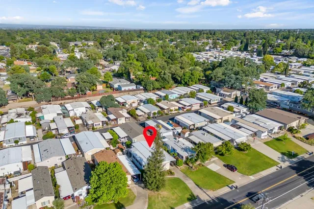 an aerial view of residential houses with outdoor space