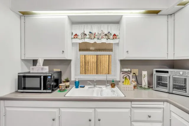a kitchen with appliances and cabinets