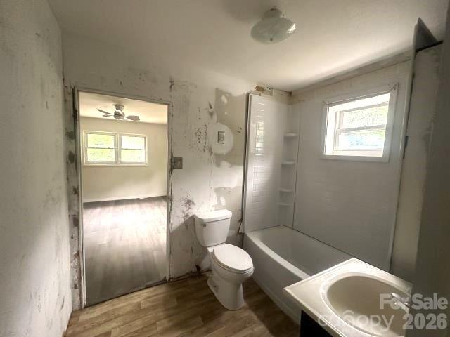 111 Dye Street Chester, SC 29706 - Photo 12 of 12 a white toilet sitting next to a bathroom sink and a tub
