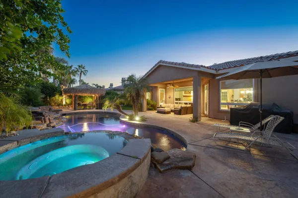 a swimming pool with outdoor seating yard and livingroom
