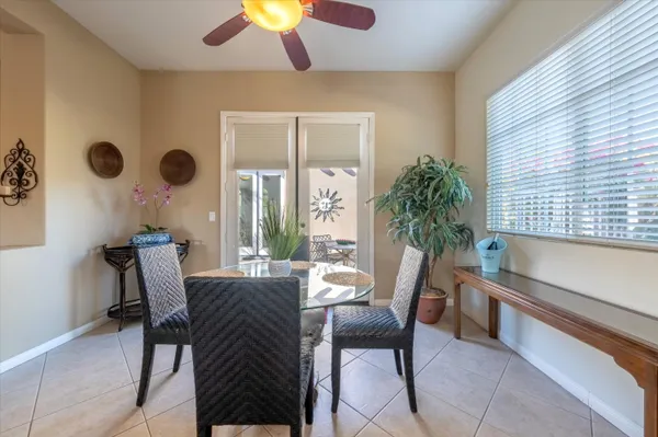 a view of a livingroom with furniture and a large window