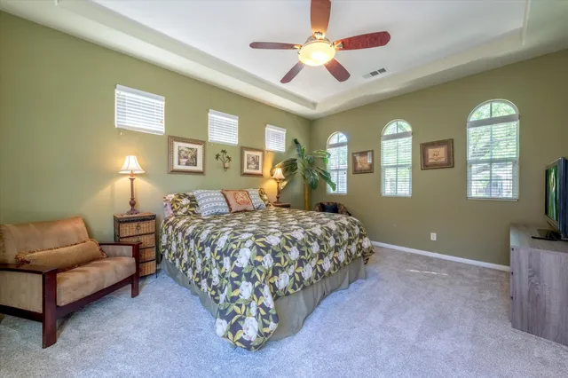 a bed room with a bed and a couch