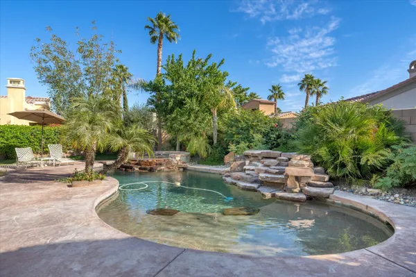 a view of a swimming pool with a patio