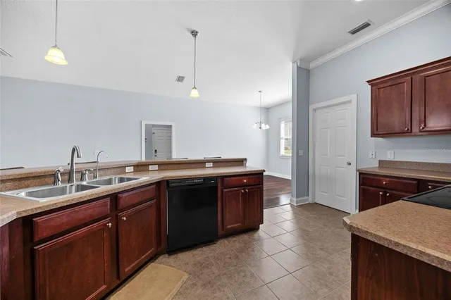 a kitchen with a sink and a stove