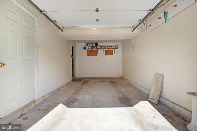 a view of a livingroom with wooden floor and staircase