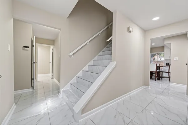 a view of a dining room with furniture and window