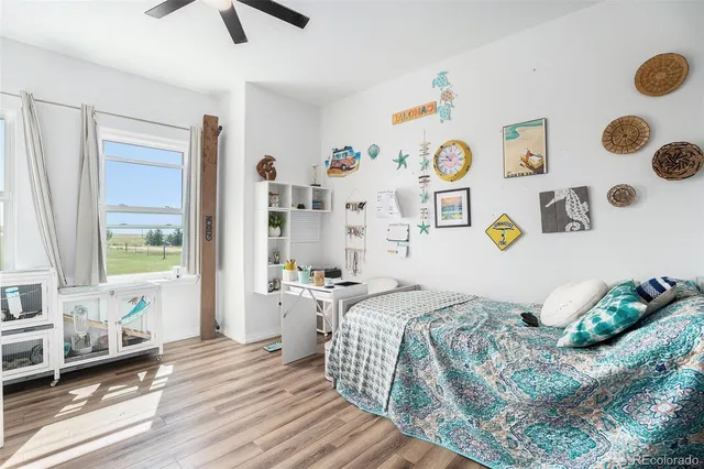 a view of a play room with furniture and toys