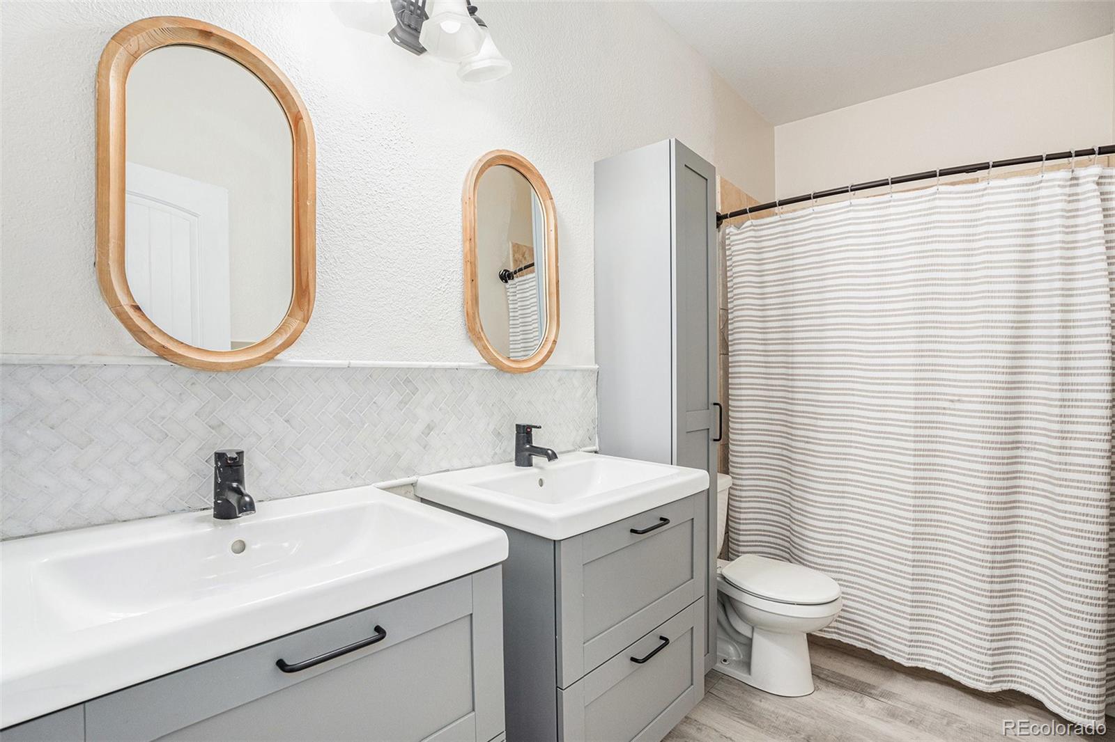 16690 Rabbit Track Trail Colorado Springs, CO 80930 - Photo 17 of 25 a bathroom with a sink and a mirror