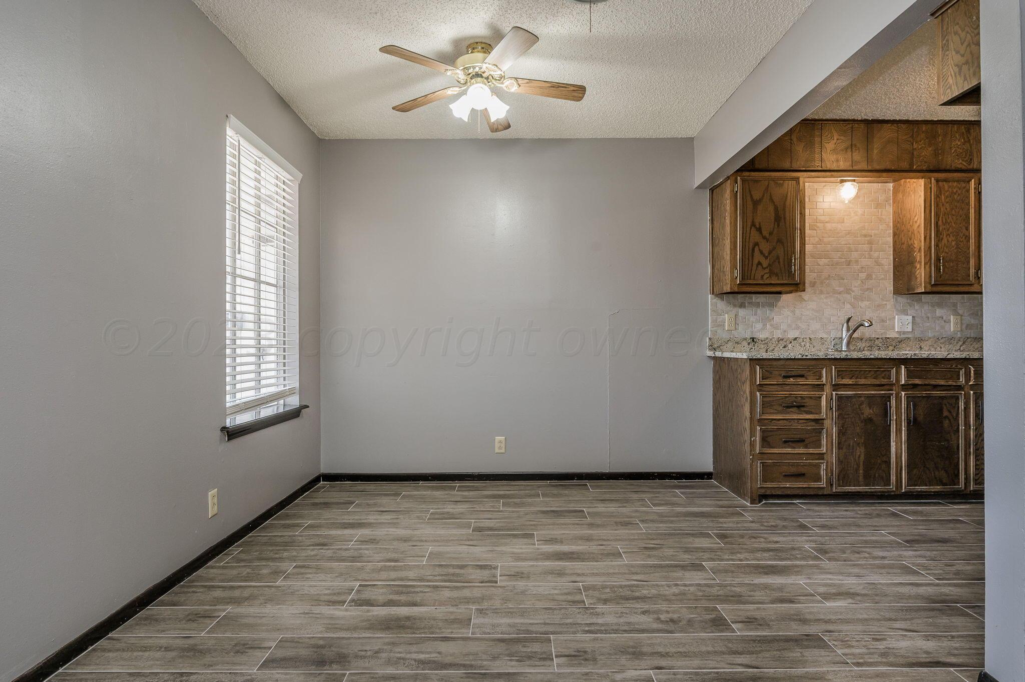 1909 Howard Drive Amarillo, TX 79106 - Photo 8 of 19 a view of a livingroom with a kitchen