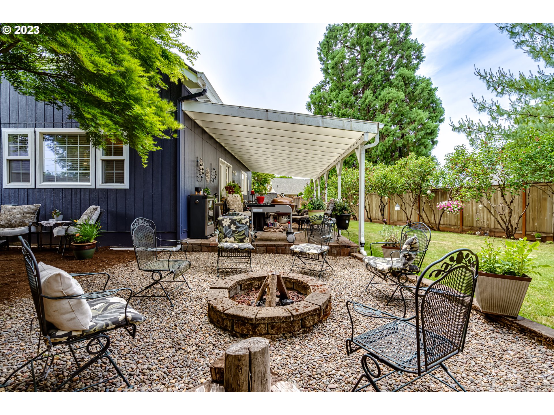 3148 W Street Springfield, OR 97477 - Photo 27 of 34 a view of backyard with outdoor seating and green space