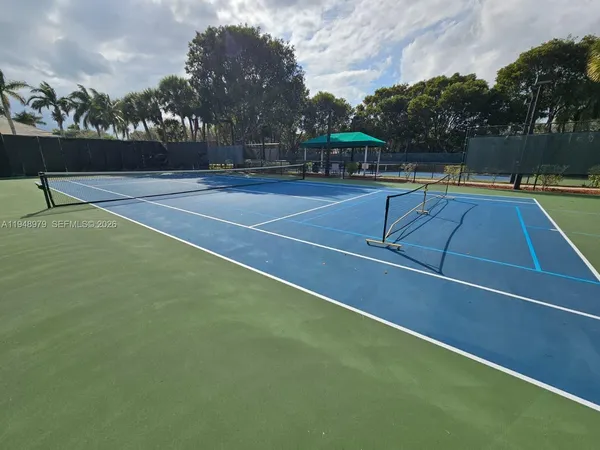 a view of an outdoor space and tennis court