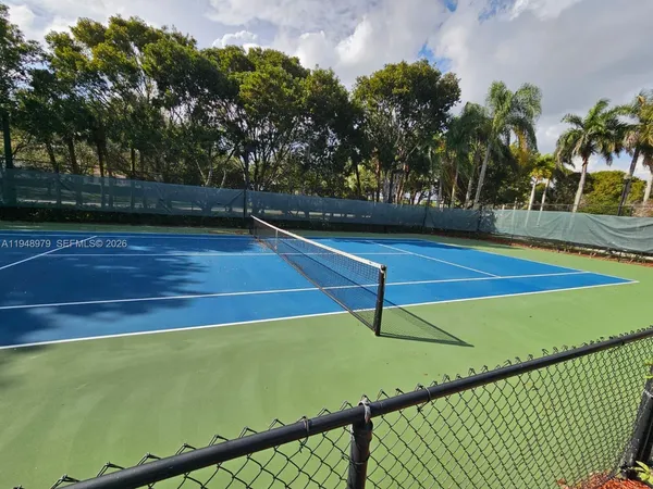 a view of an outdoor space and tennis court