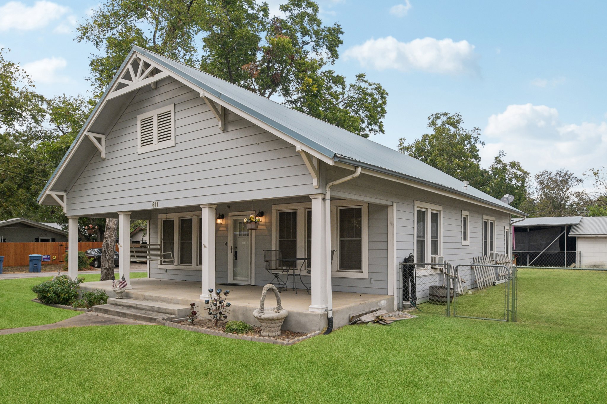 611 North Main Street Elgin, TX 78621 - Photo 2 of 26 a view of a house with a yard and sitting area