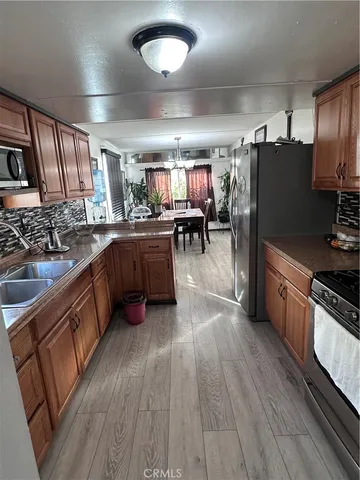 a kitchen with lots of counter top space and stainless steel appliances