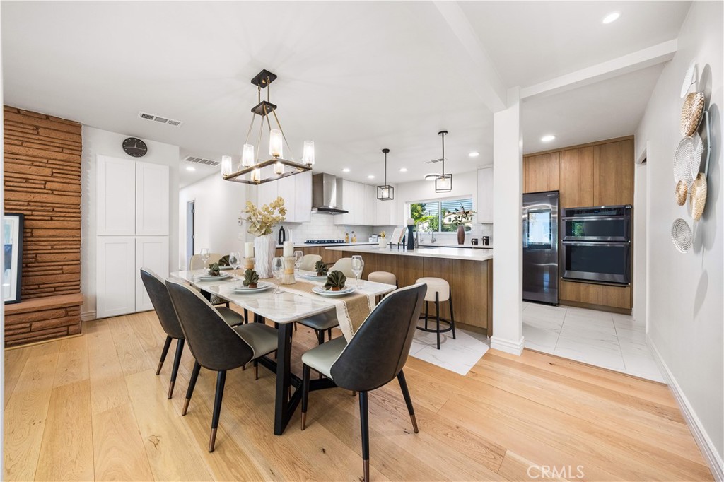 240 Longley Way Arcadia, CA 91007 - Photo 11 of 50 a dining room filled chandelier and wooden floor