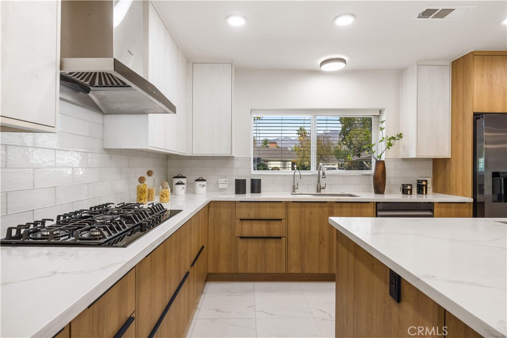240 Longley Way Arcadia, CA 91007 - Photo 15 of 50 a kitchen with a sink a stove and cabinets