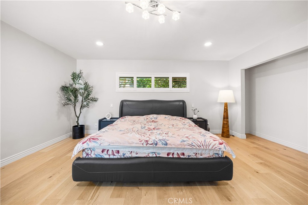 240 Longley Way Arcadia, CA 91007 - Photo 30 of 50 a bedroom with a bed and a potted plant