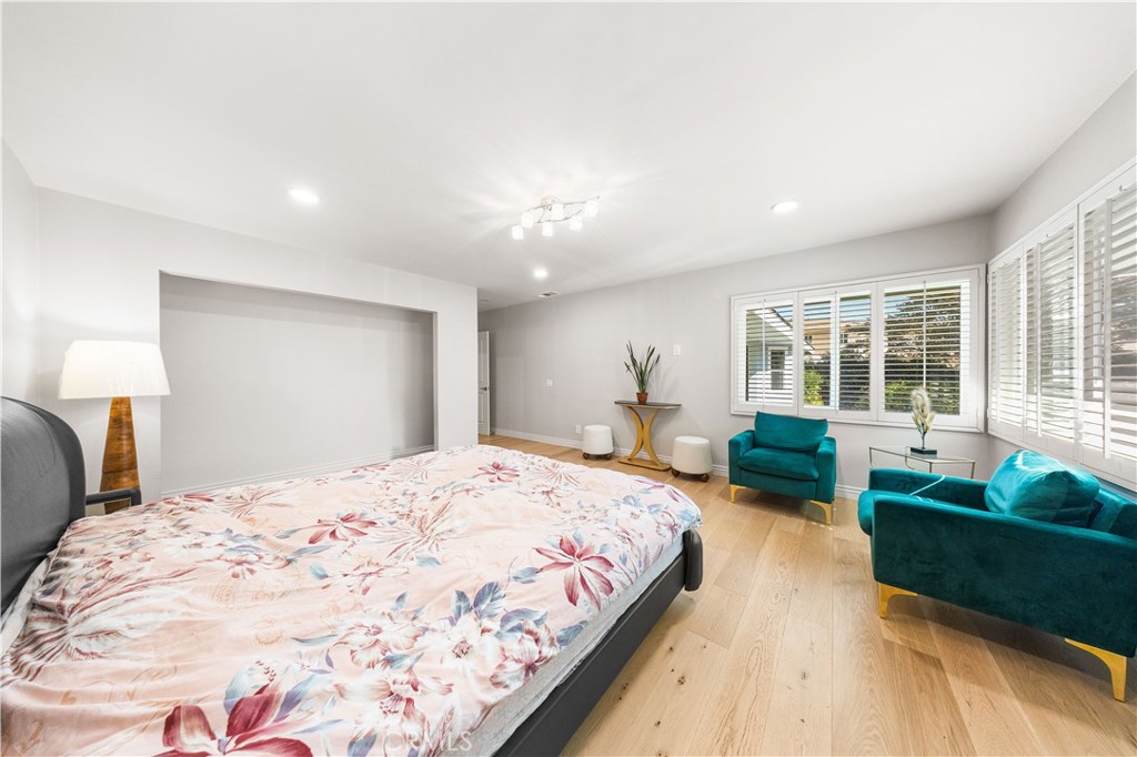 240 Longley Way Arcadia, CA 91007 - Photo 31 of 50 a spacious bedroom with a bed and a couch