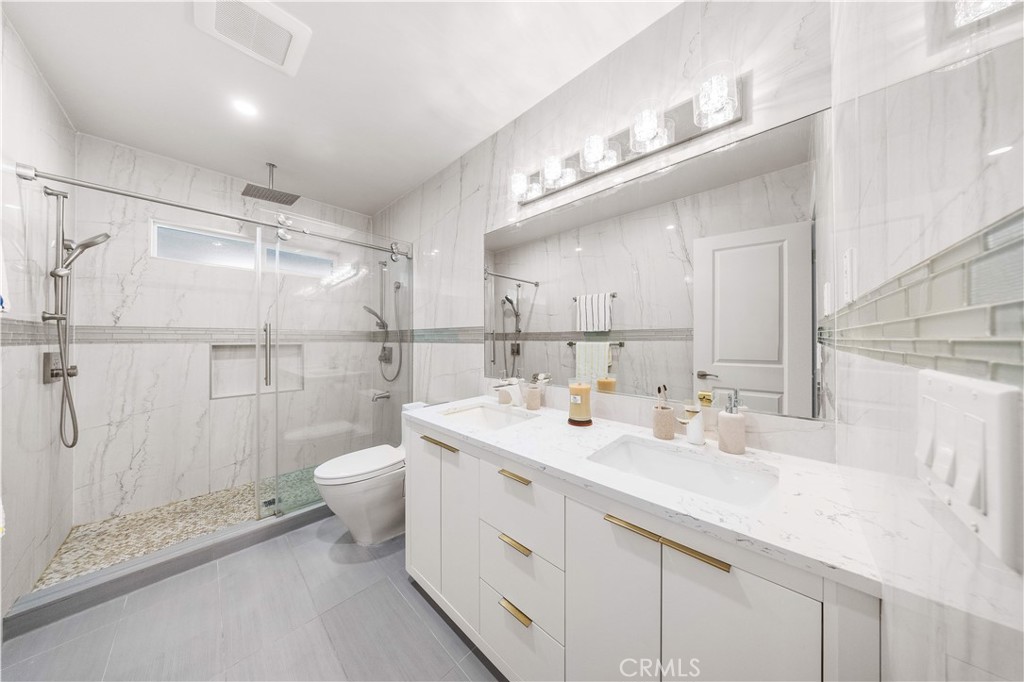 240 Longley Way Arcadia, CA 91007 - Photo 33 of 50 a bathroom with a double vanity sink toilet and shower