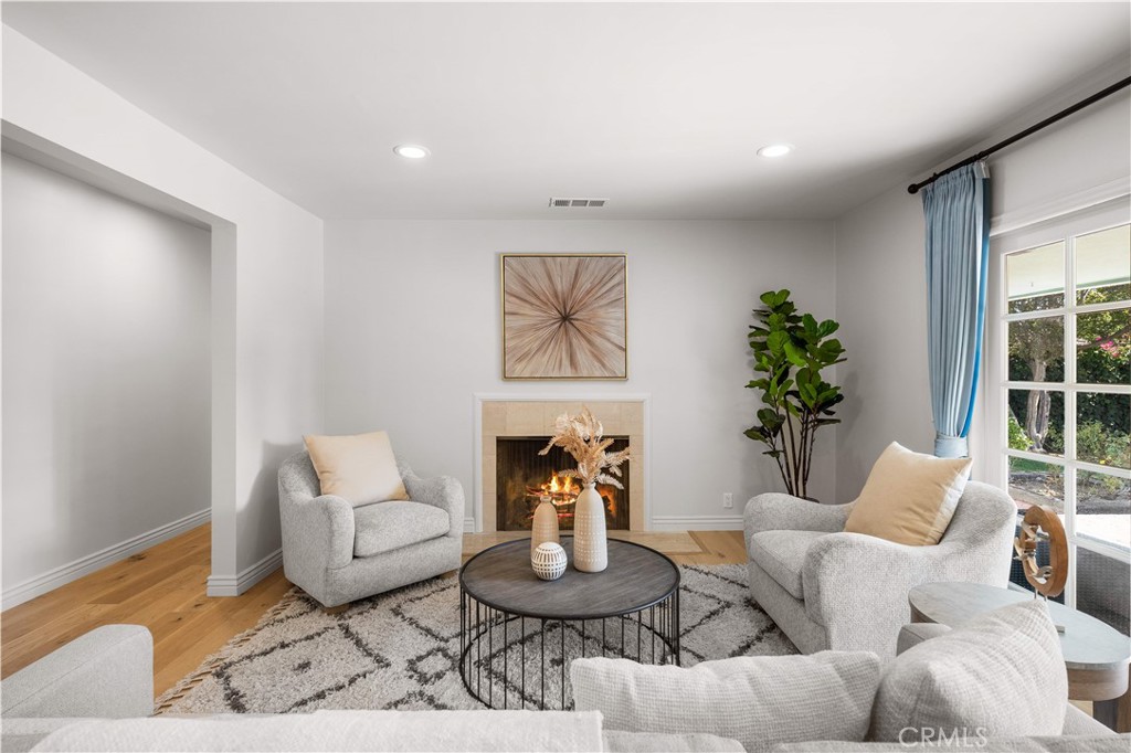 240 Longley Way Arcadia, CA 91007 - Photo 7 of 50 a living room with furniture a rug and a potted plant