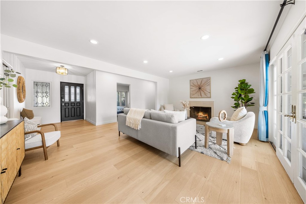 240 Longley Way Arcadia, CA 91007 - Photo 8 of 50 a living room with furniture and a wooden floor
