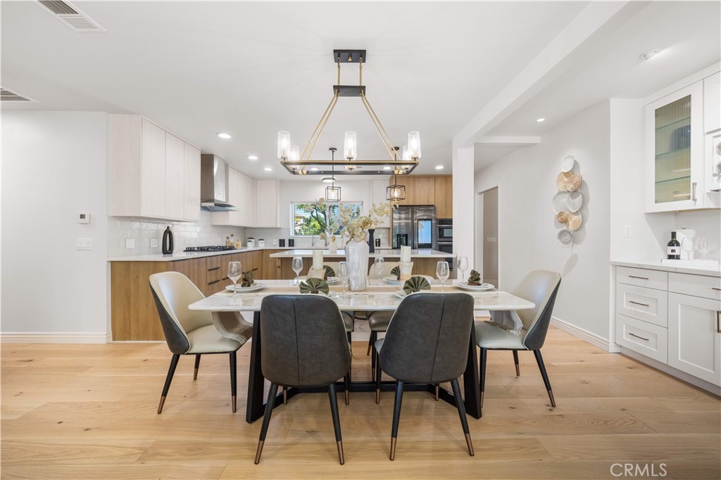 240 Longley Way Arcadia, CA 91007 - Photo 10 of 50 a dining area with furniture a rug and a painting