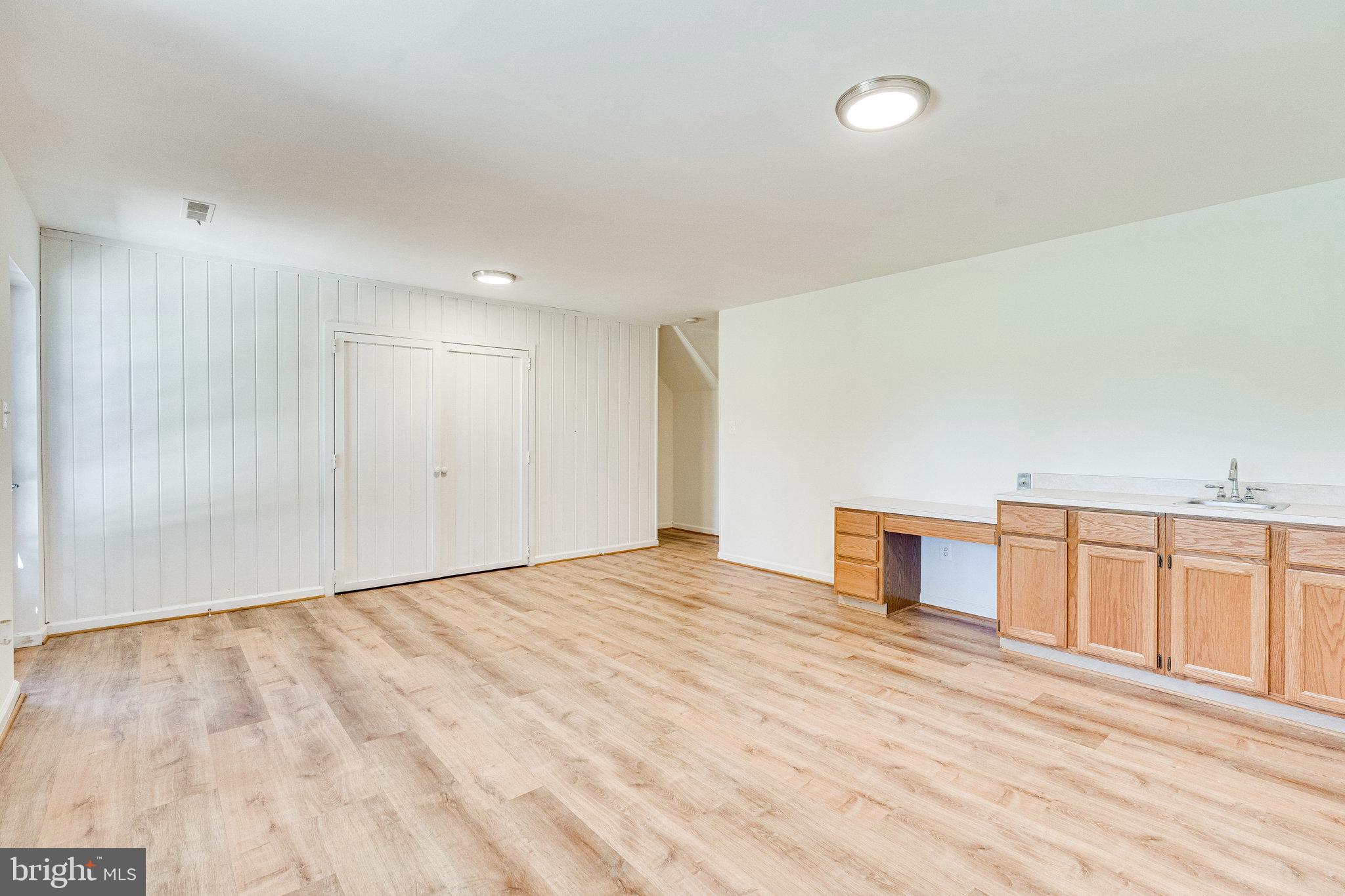 2186 Golf Course Drive Reston, VA 20191 - Photo 22 of 36 a view of empty room with wooden floor