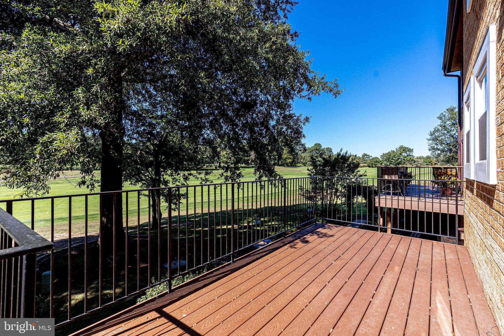 2186 Golf Course Drive Reston, VA 20191 - Photo 24 of 36 a view of balcony with wooden floor and fence