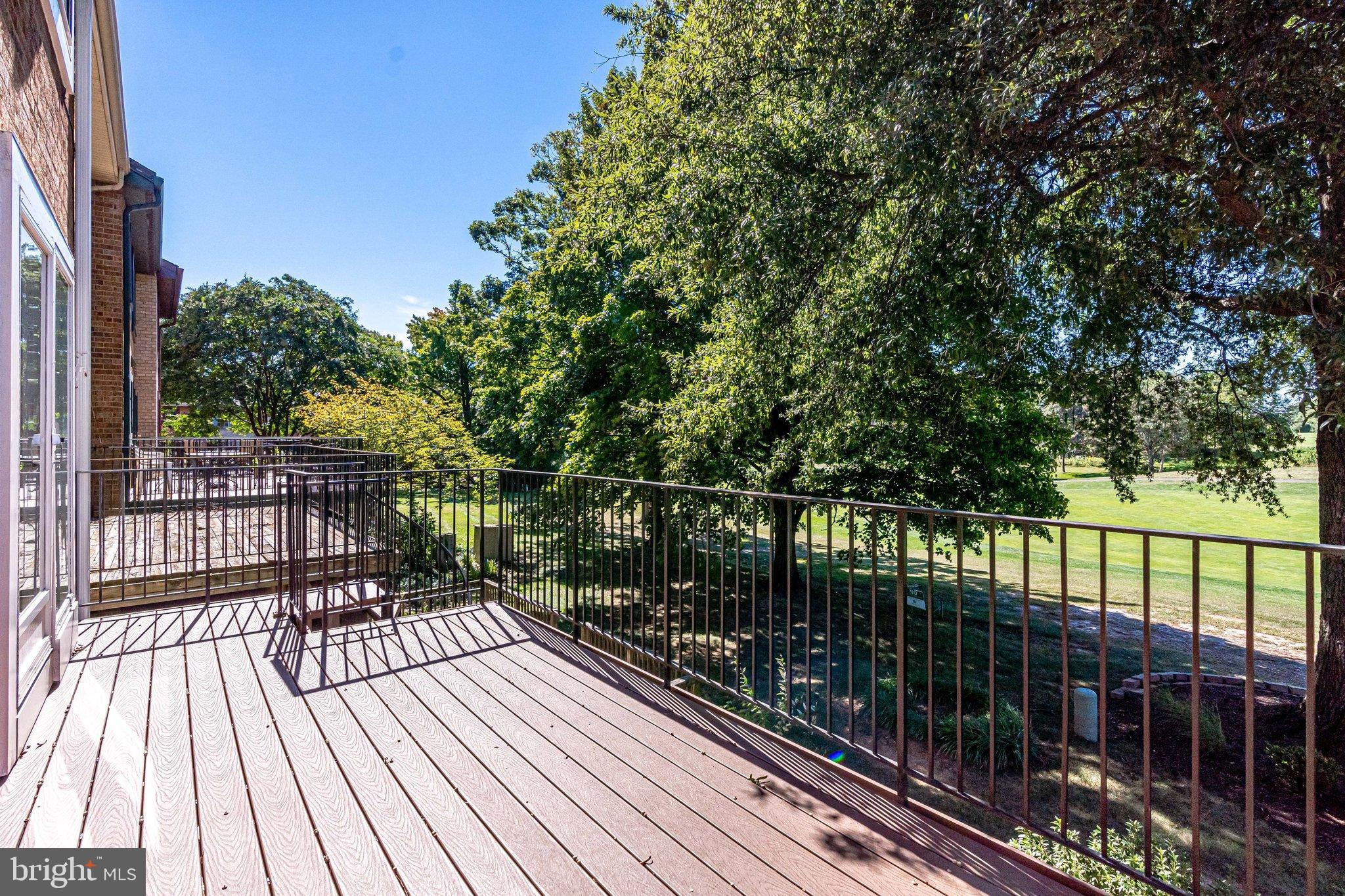 2186 Golf Course Drive Reston, VA 20191 - Photo 25 of 36 a view of balcony with wooden floor and fence