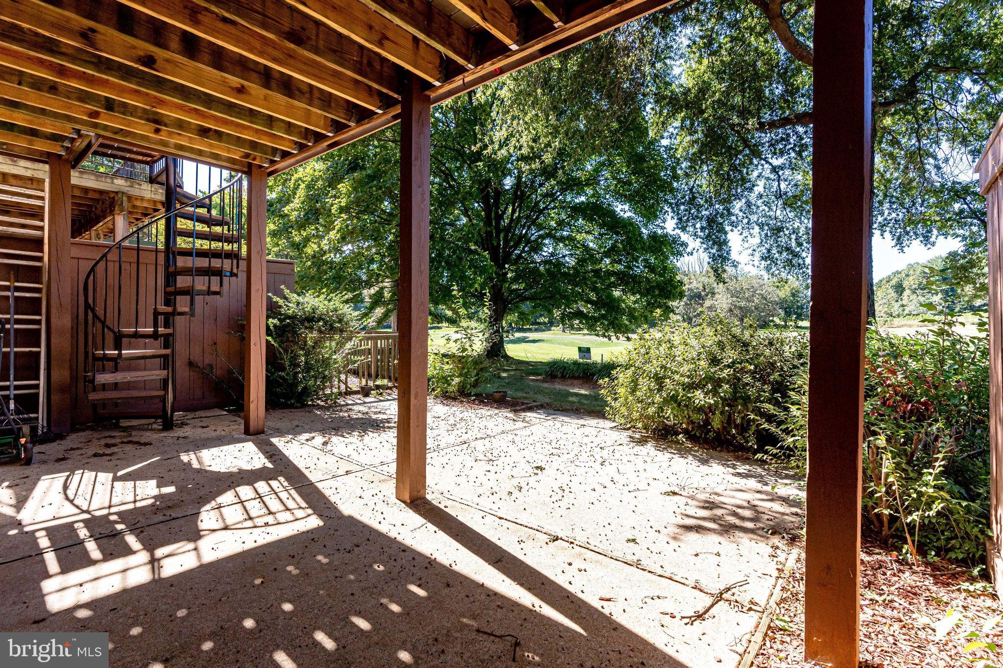 2186 Golf Course Drive Reston, VA 20191 - Photo 29 of 36 a view of a backyard with large tree