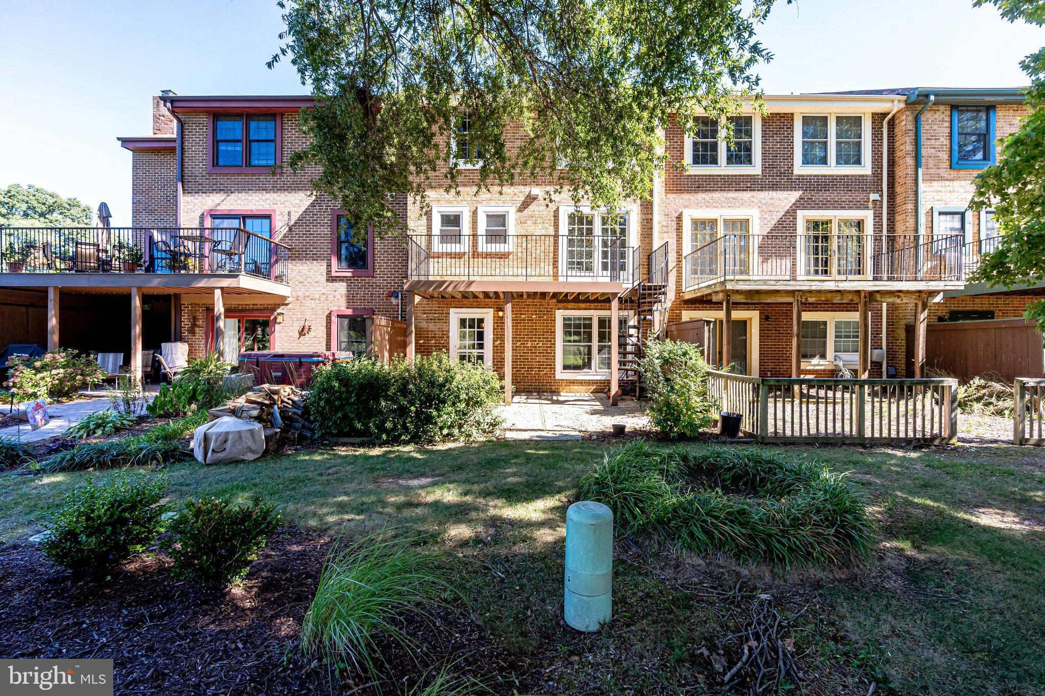 2186 Golf Course Drive Reston, VA 20191 - Photo 30 of 36 a view of a house with backyard sitting area and garden