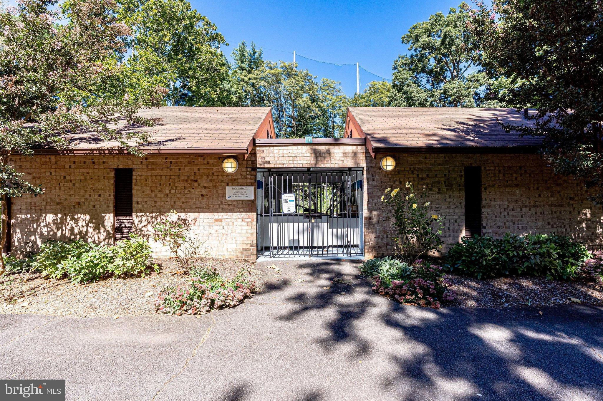 2186 Golf Course Drive Reston, VA 20191 - Photo 32 of 36 a front view of a house with garden