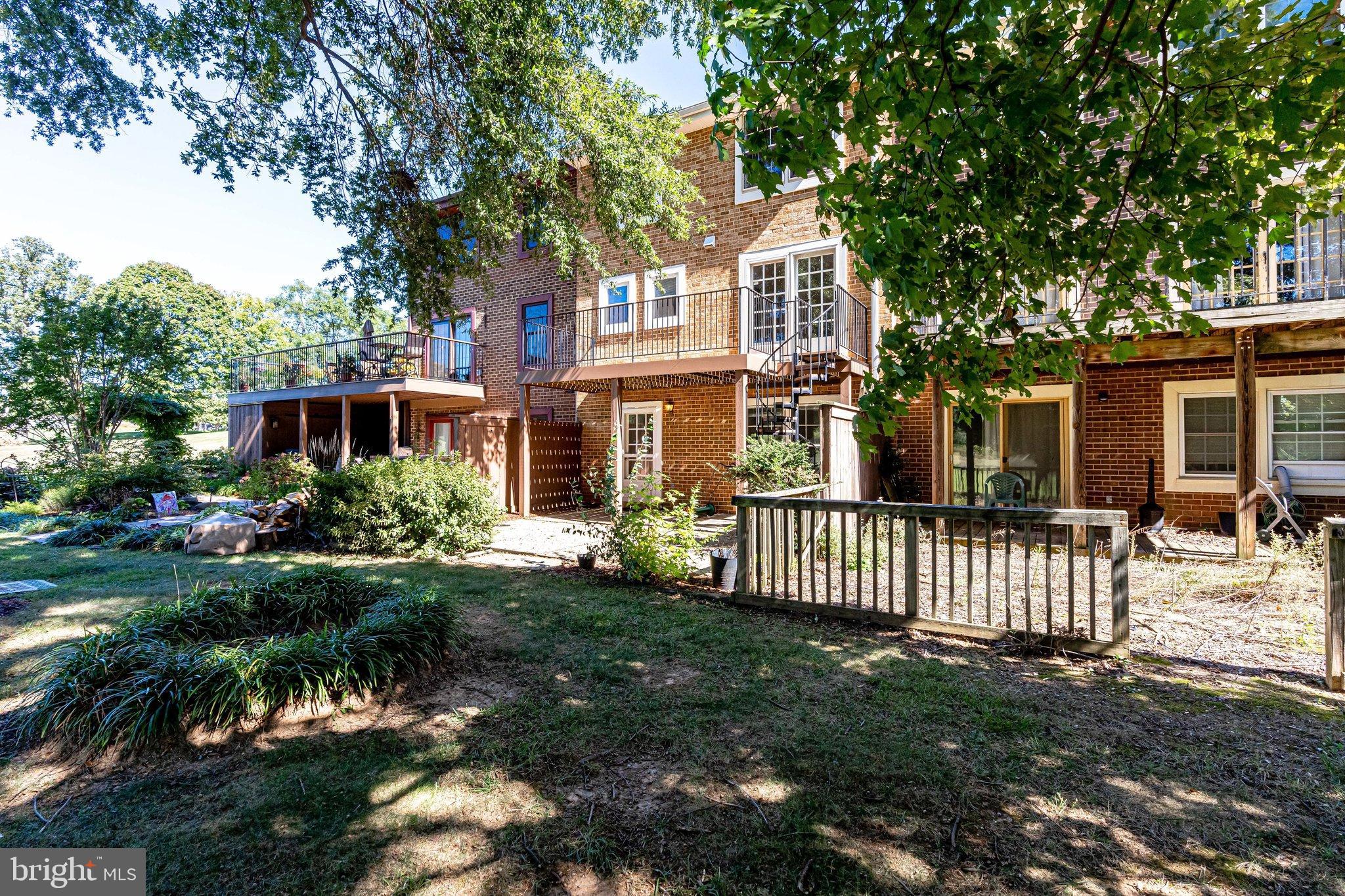 2186 Golf Course Drive Reston, VA 20191 - Photo 35 of 36 a front view of a house with a garden