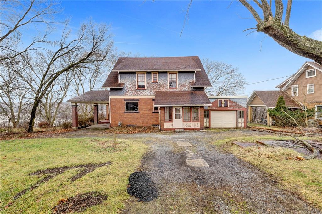 631 Riverview Road Freedom, PA 15042 - Photo 1 of 43 a front view of a house with a yard