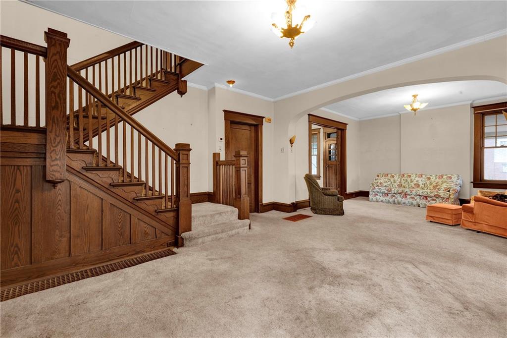 631 Riverview Road Freedom, PA 15042 - Photo 11 of 43 a view of a livingroom with furniture and stairs