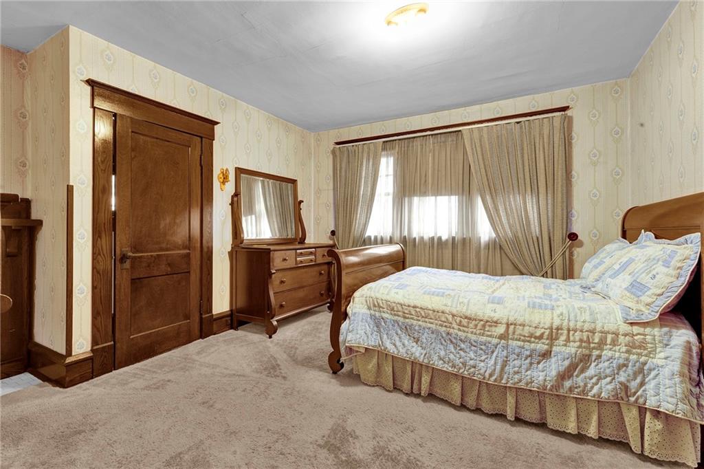 631 Riverview Road Freedom, PA 15042 - Photo 22 of 43 a bedroom with a bed dresser and a large window