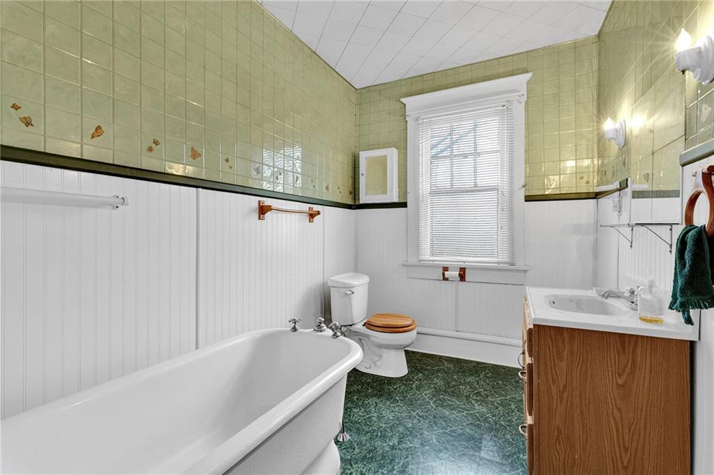 631 Riverview Road Freedom, PA 15042 - Photo 27 of 43 a bathroom with a sink a toilet and bathtub