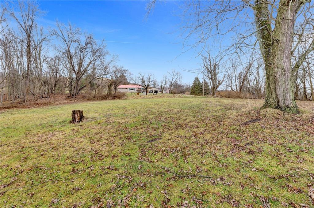 631 Riverview Road Freedom, PA 15042 - Photo 35 of 43 a view of a field with trees in the background