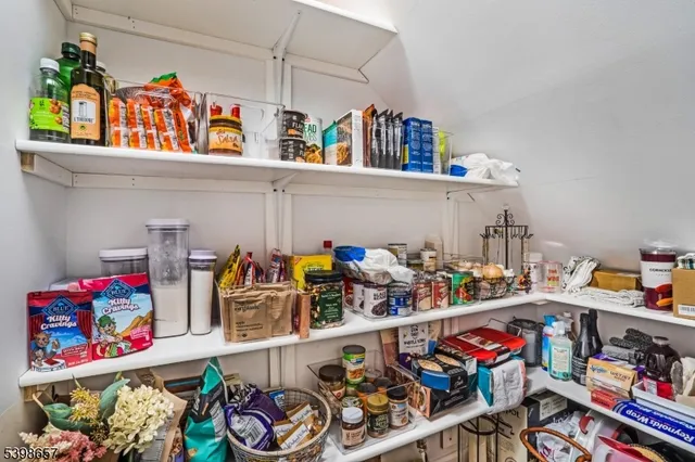 a store room with lots of clutter and flowers