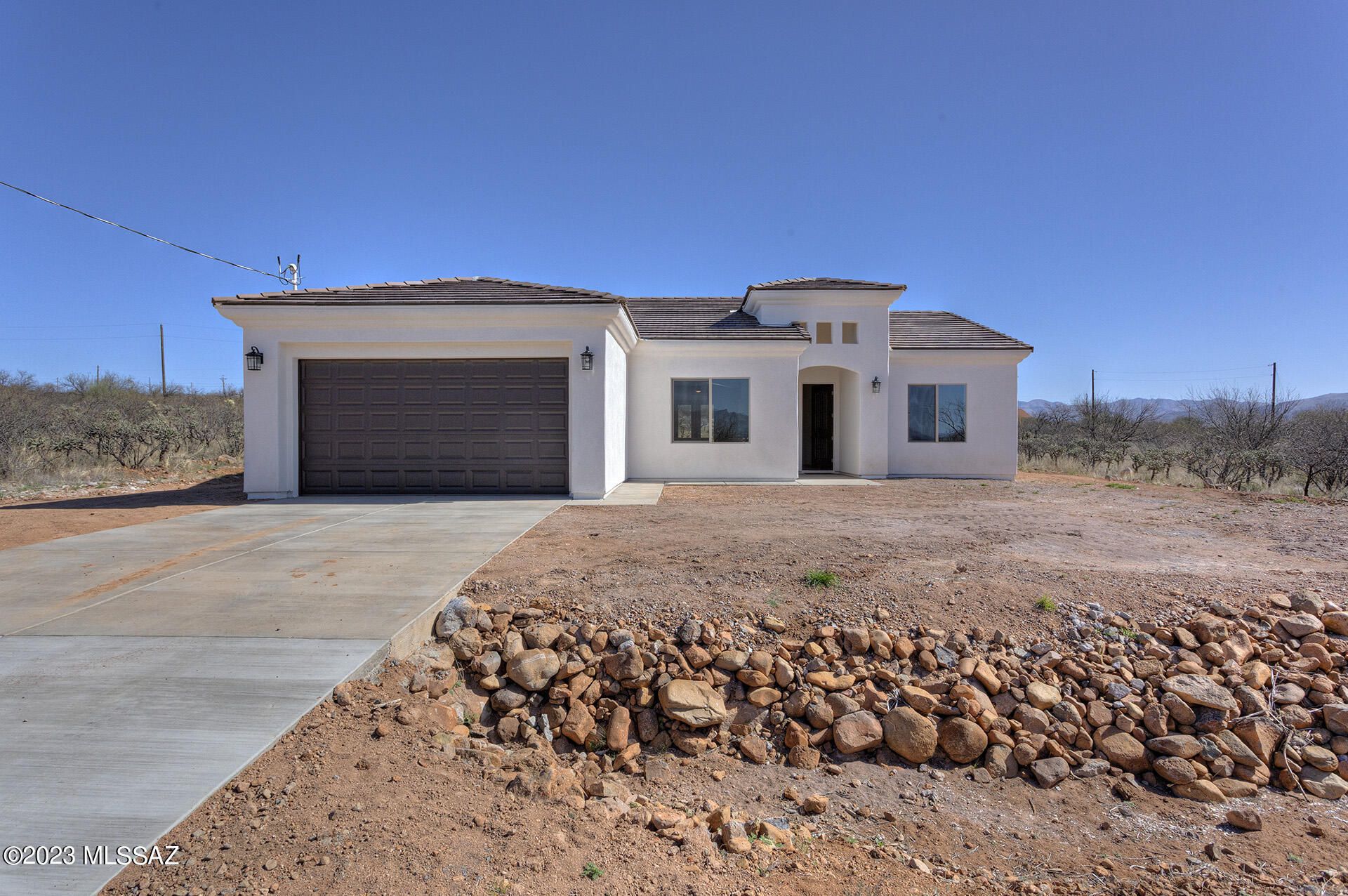 1813 Cajeme Court Rio Rico, AZ 85648 - Photo 1 of 15 a front view of a house with a yard