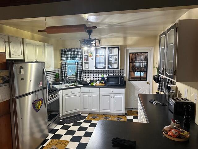 1198 North Babcock Road Chesterton, IN 46304 - Photo 3 of 13 a kitchen with stainless steel appliances granite countertop a refrigerator and a sink