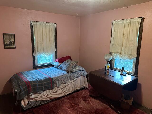 1198 North Babcock Road Chesterton, IN 46304 - Photo 8 of 13 a bedroom with a bed and a table