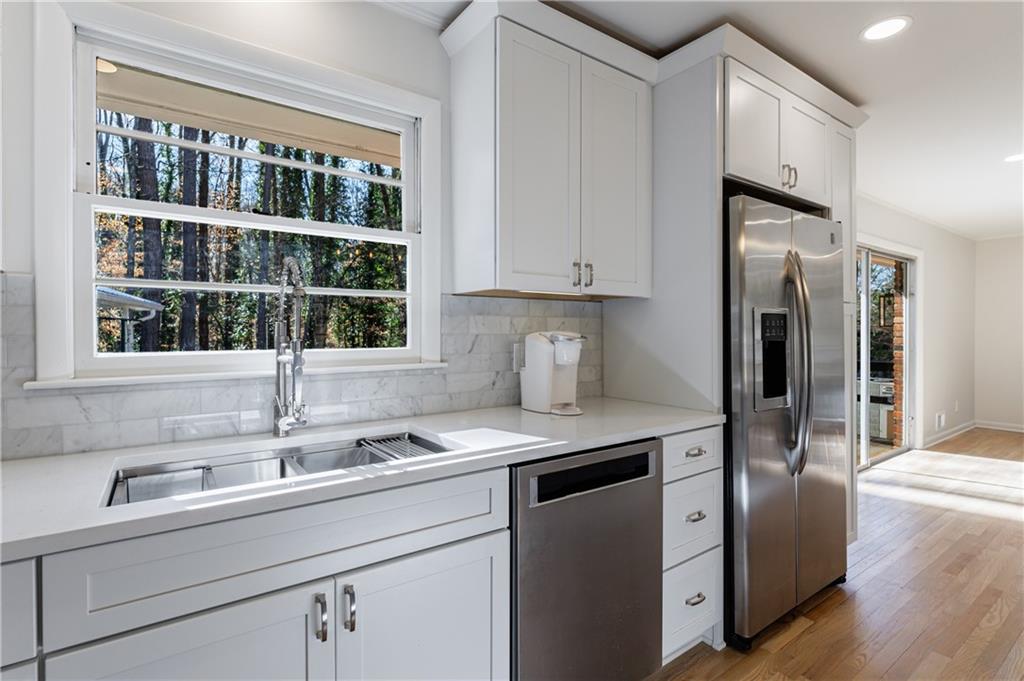2996 Arrowood Drive East Point, GA 30344 - Photo 15 of 63 a kitchen with a sink cabinets and window