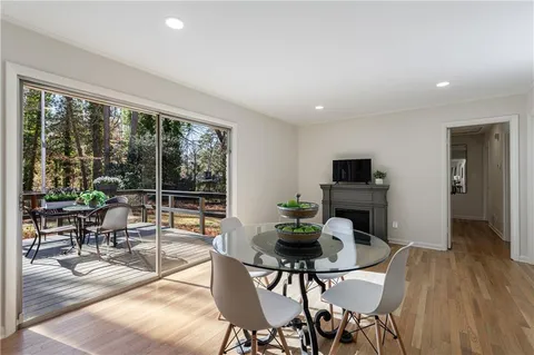 a living room with furniture and a ceiling fan