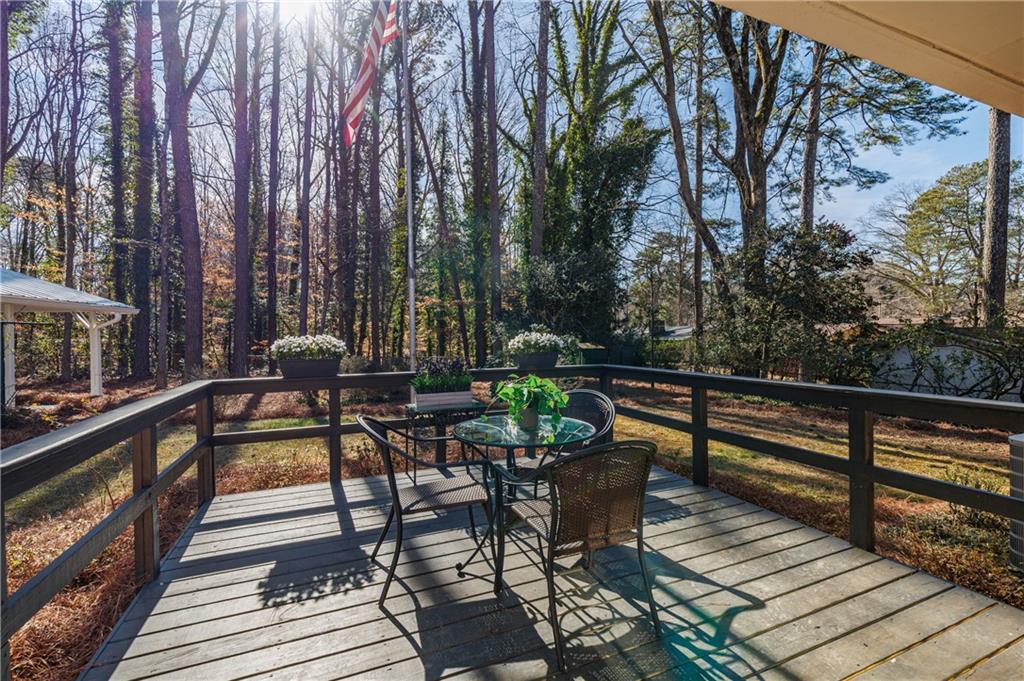 2996 Arrowood Drive East Point, GA 30344 - Photo 19 of 63 a view of balcony with wooden floor and outdoor seating