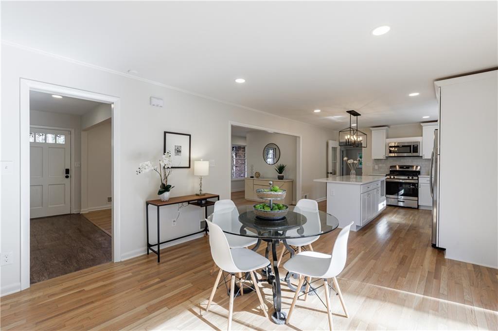 2996 Arrowood Drive East Point, GA 30344 - Photo 22 of 63 a dining room with furniture and wooden floor