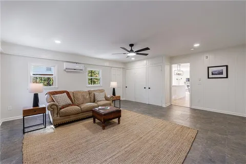 a living room with furniture and a window