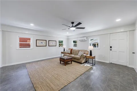 a living room with furniture and a window
